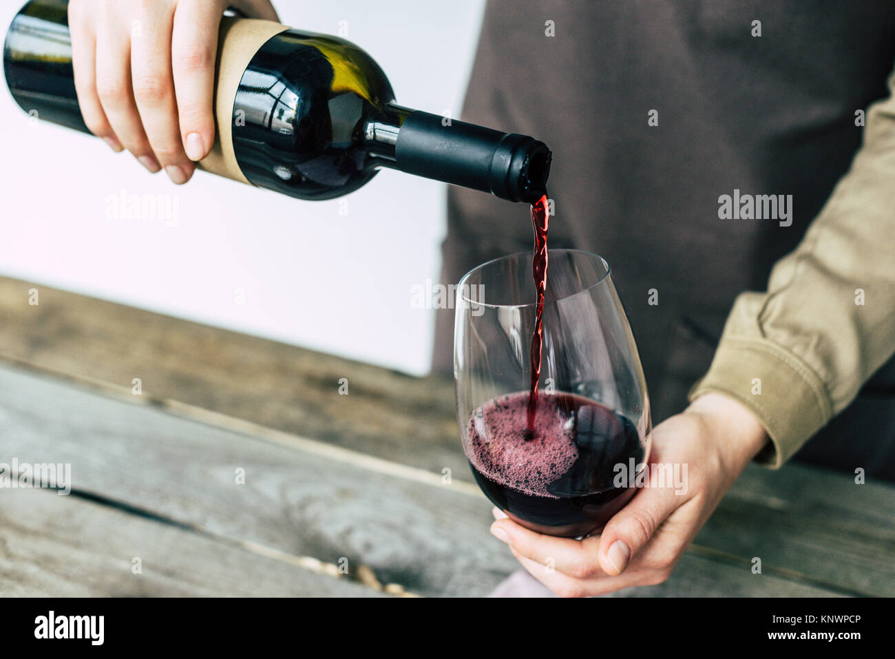 sommelier pouring red wine into glass  Stock Photo