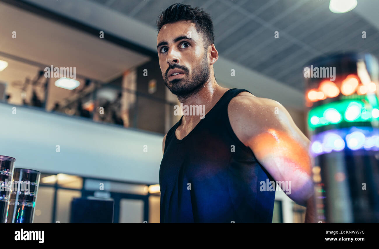 Sportsman with lights around to improve reaction time at gym. Athlete
