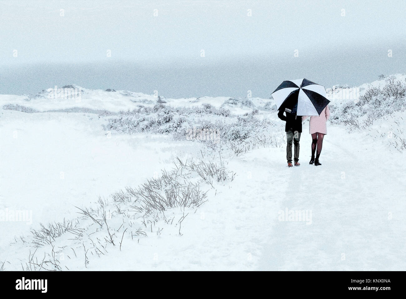 Romantic couple snow rear view hi-res stock photography and images - Alamy