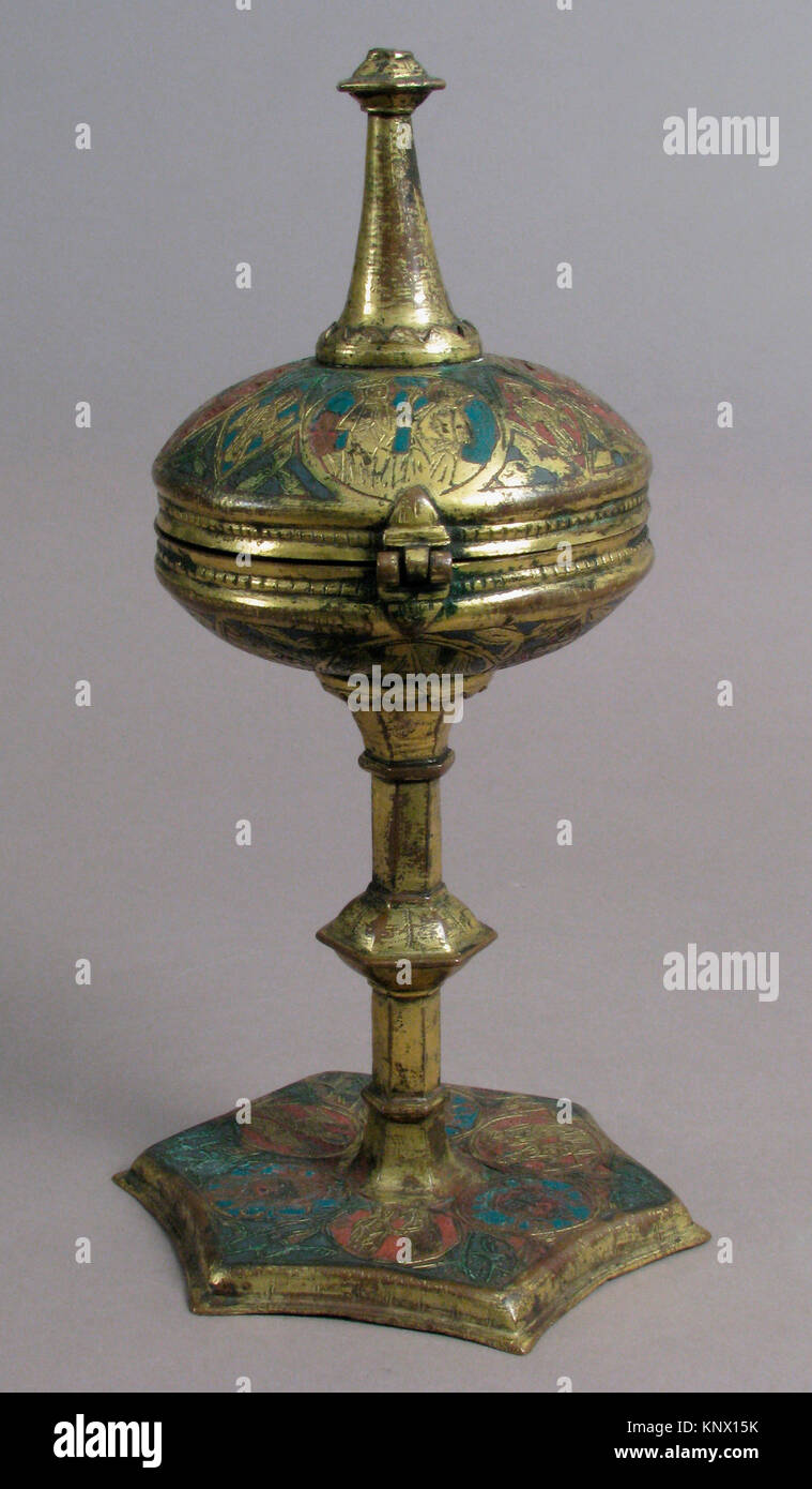 Ciborium. Date: 14th century; Culture: Spanish; Medium: Champlevé enamel, copper-gilt; Dimensions: Overall: 10 1/4 x 5 9/16 in. (26.1 x 14.2 cm); Stock Photo