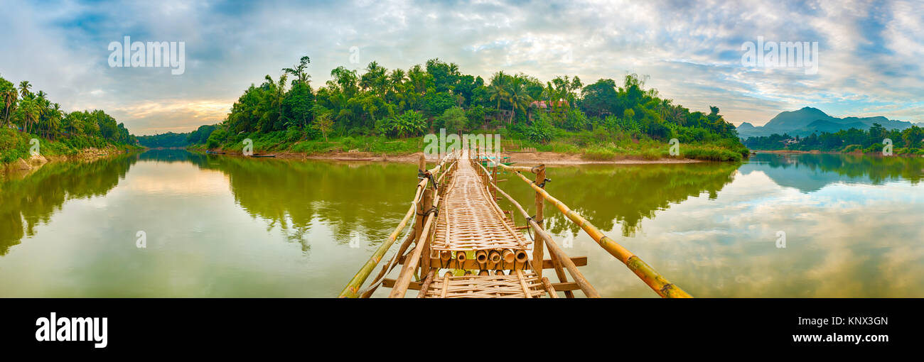 Beautiful view of a bamboo bridge. Luang Prabang. Laos landscape. Panorama Stock Photo