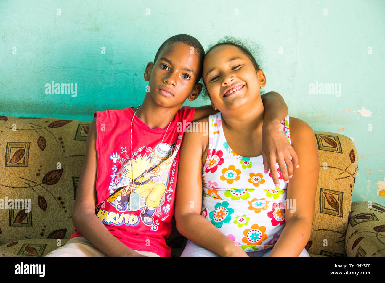 Brother and sister in their home in Cienfuegos, Cuba Stock Photo