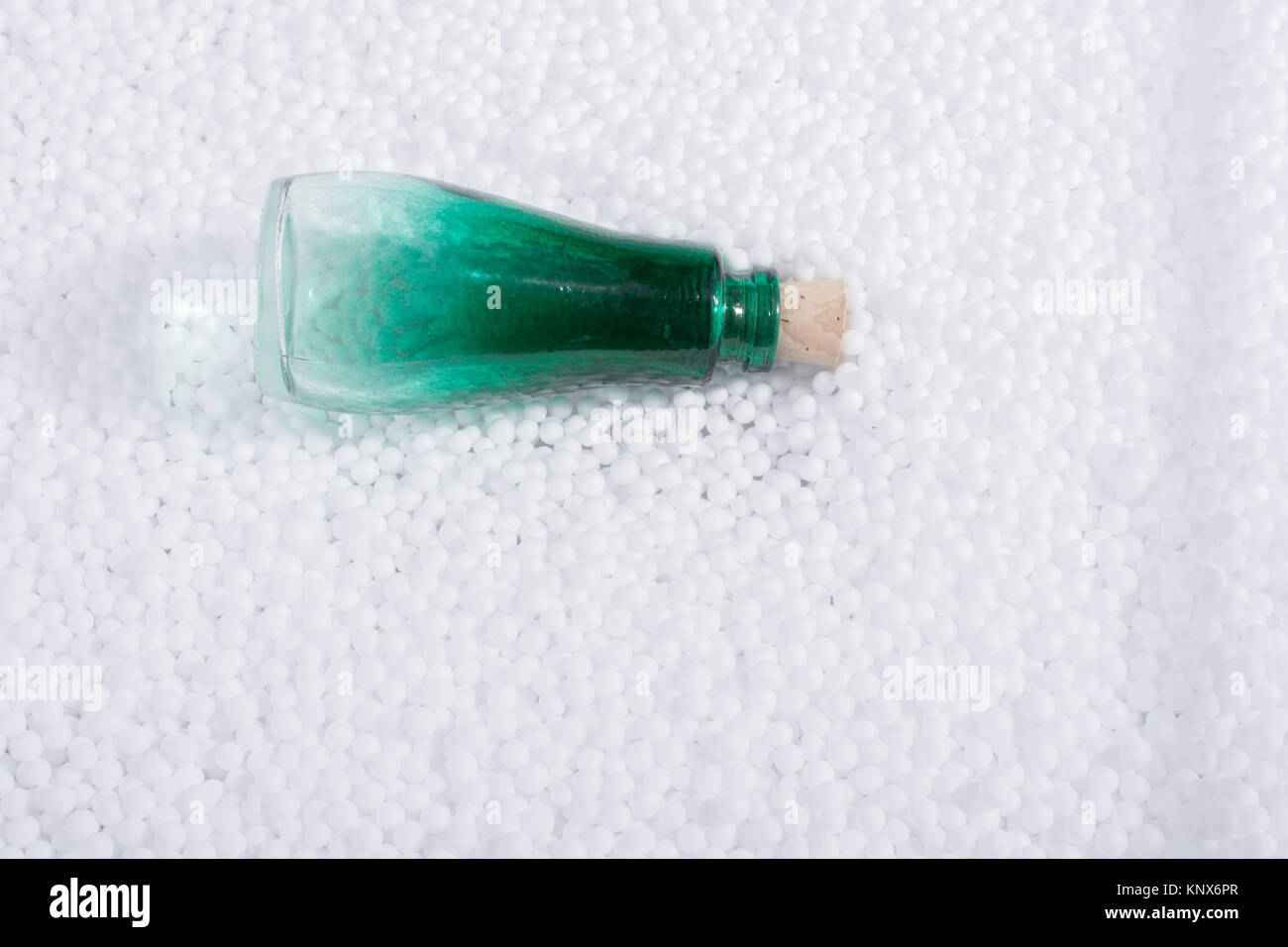 Empty bottle on little white polystyrene foam balls Stock Photo - Alamy