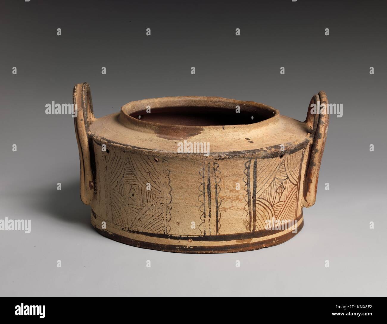 Terracotta pyxis (cylindrical box). Period: Late Minoan III; Date: ca. 1400-1100 B.C; Culture: Minoan; Medium: Terracotta; Dimensions: diameter 10 Stock Photo