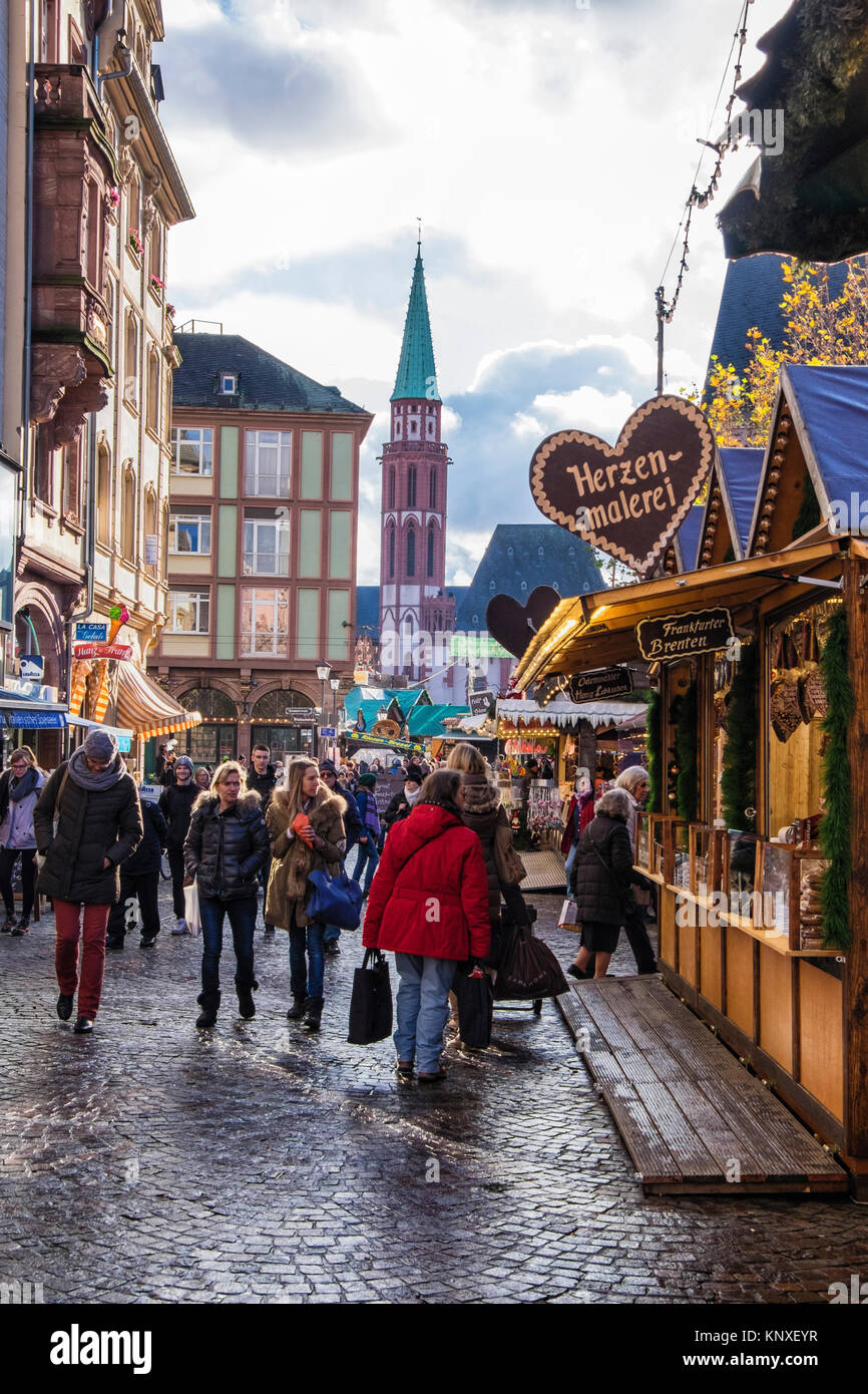 Frankfurt,Germany. People enjoyTraditional German Market stalls in Römerberg square with half-timbered historic buildings and St.Nicholas church Stock Photo