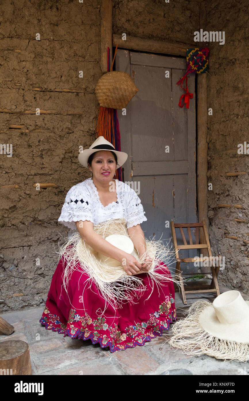 Panama Hats - Cuenca Ecuador - an ecuadorian woman demonstrating the traditional weaving of a Panama Hat, Homero Ortega Hats, Cuenca, Ecuador Stock Photo