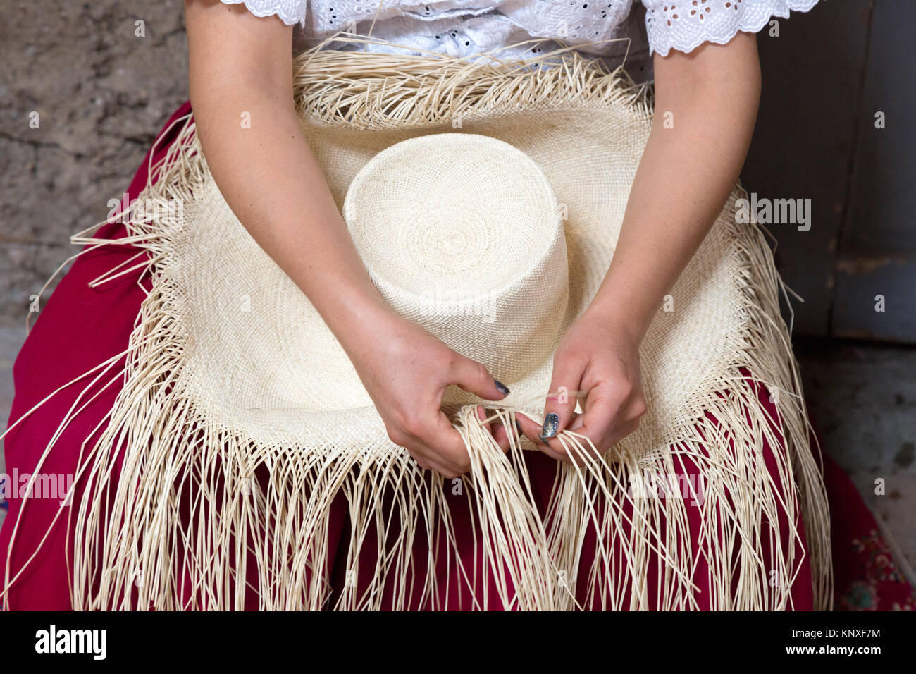Weaving a panama hat the traditional way, close up; Homero Ortega factory & Museum, Cuenca, Ecuador South America Stock Photo