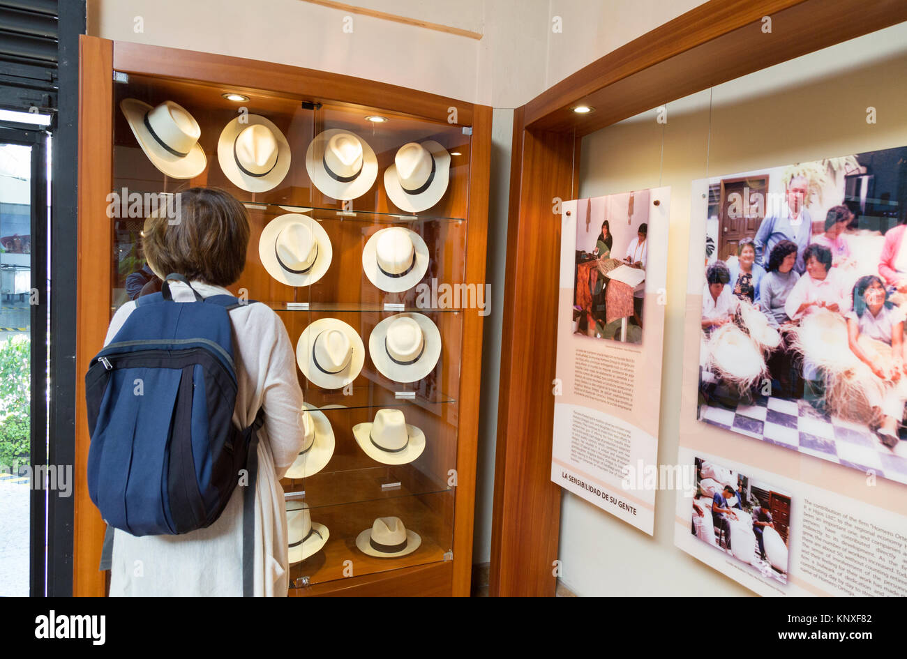 Panama hats - A tourist looking at panama hats, Homero Ortega Panama Hat factory and Museum, Cuenca, Ecuador, South America Stock Photo