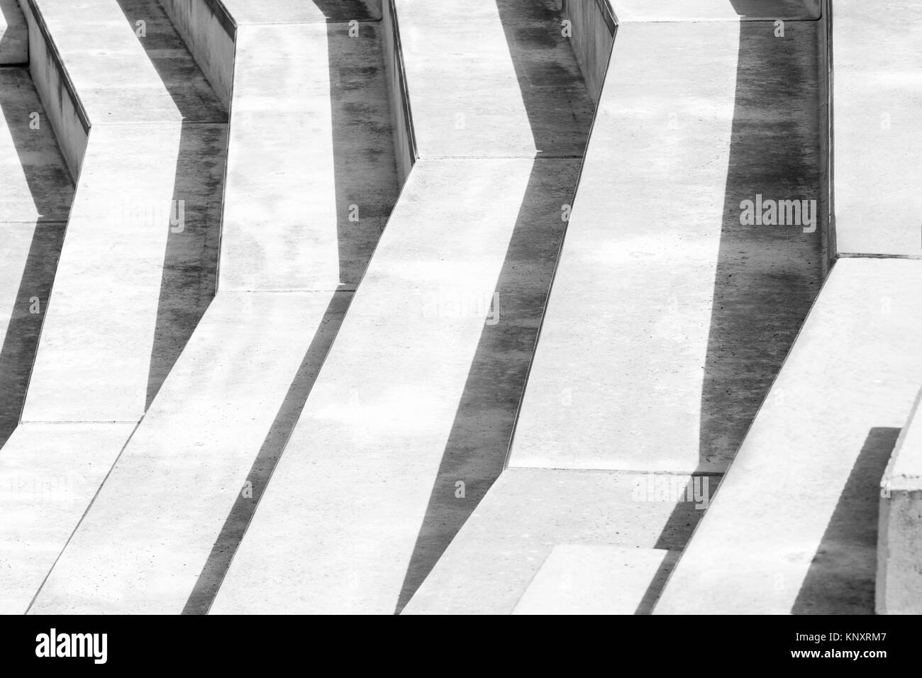 Black and white photograph of a concrete structure with big steps. Stock Photo