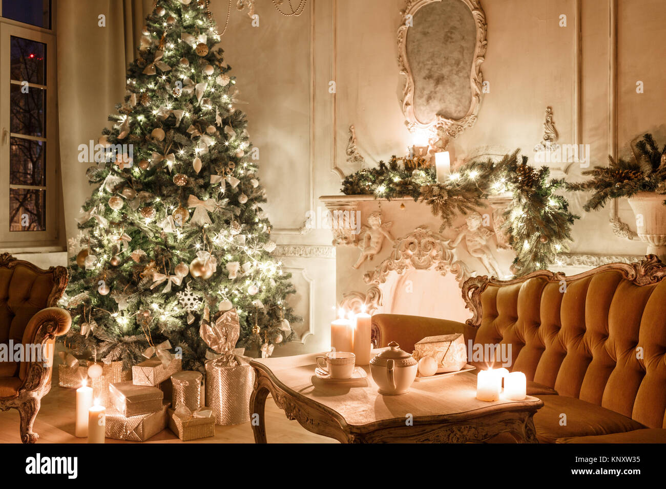 Christmas evening by candlelight. classic apartments with a white