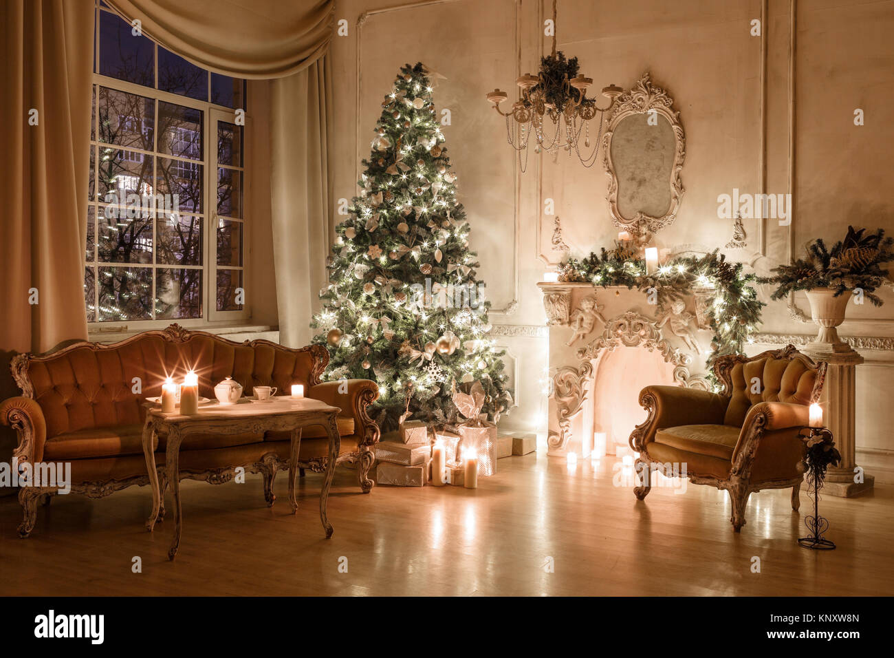 Christmas evening by candlelight. classic apartments with a white