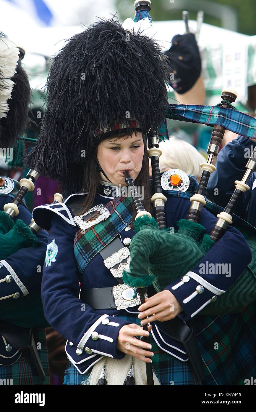 A marching pipe band performing at Highland Games. Aboyne