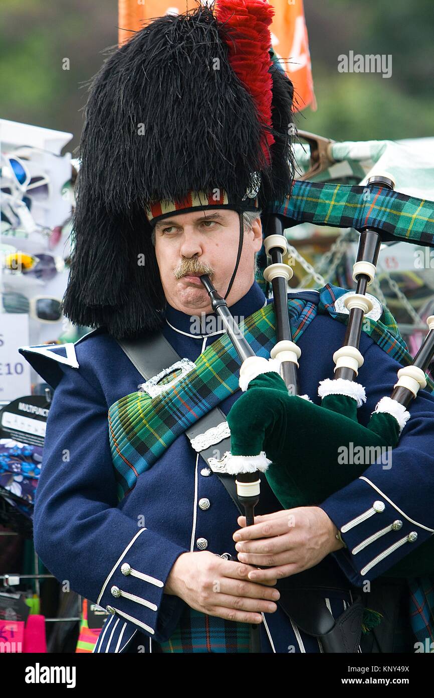 A marching pipe band performing at Highland Games. Aboyne