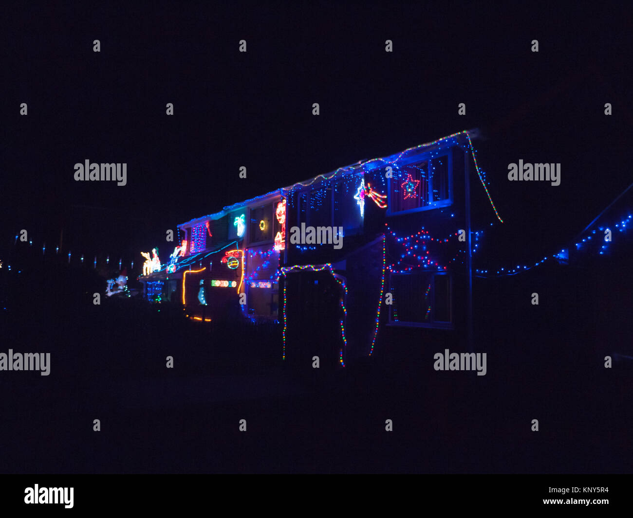 house at night covering in christmas lights decoration electricity private ornaments xmas; essex