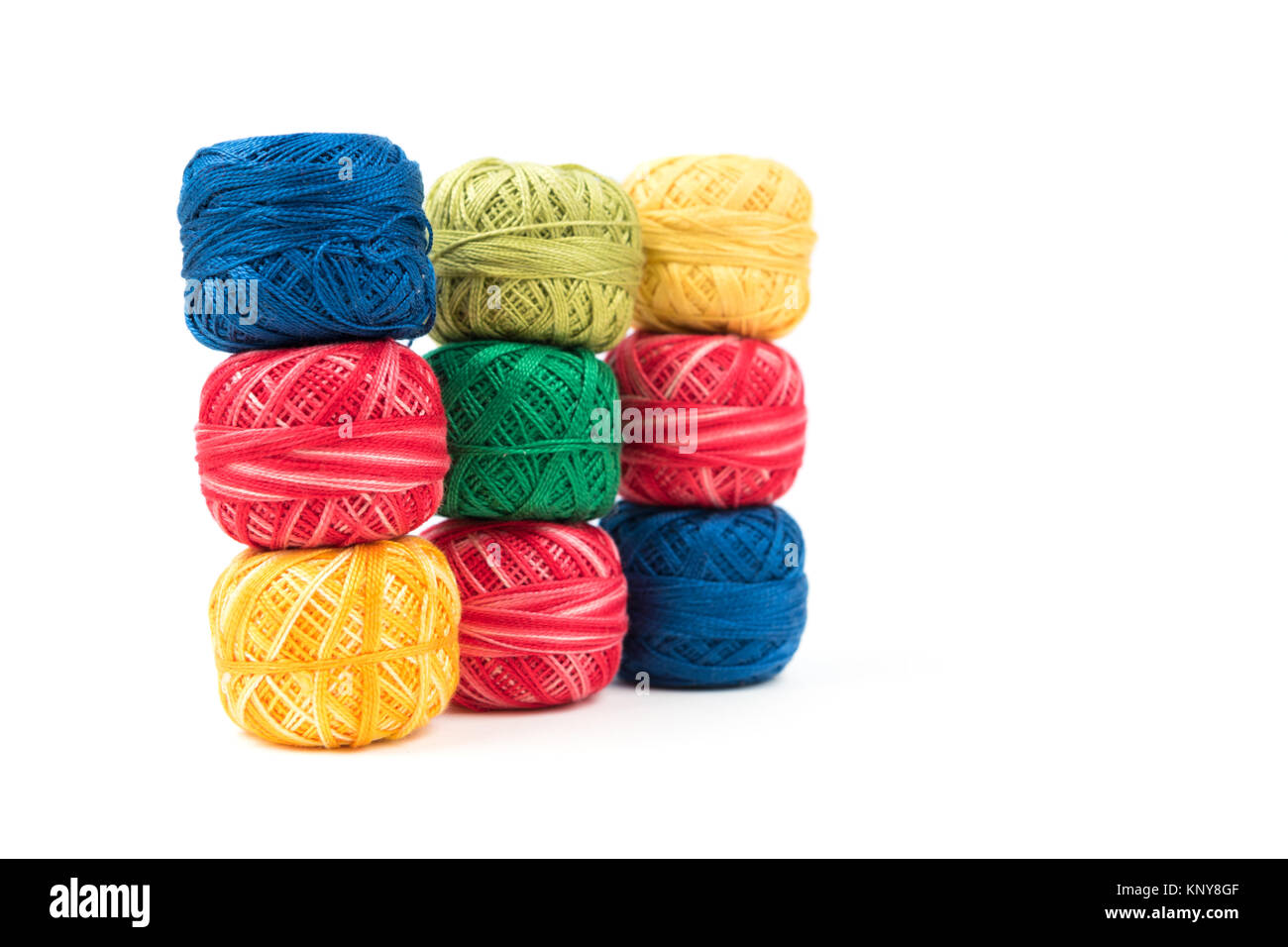 Colorful sewing threads as background or wallpaper Stock Photo - Alamy