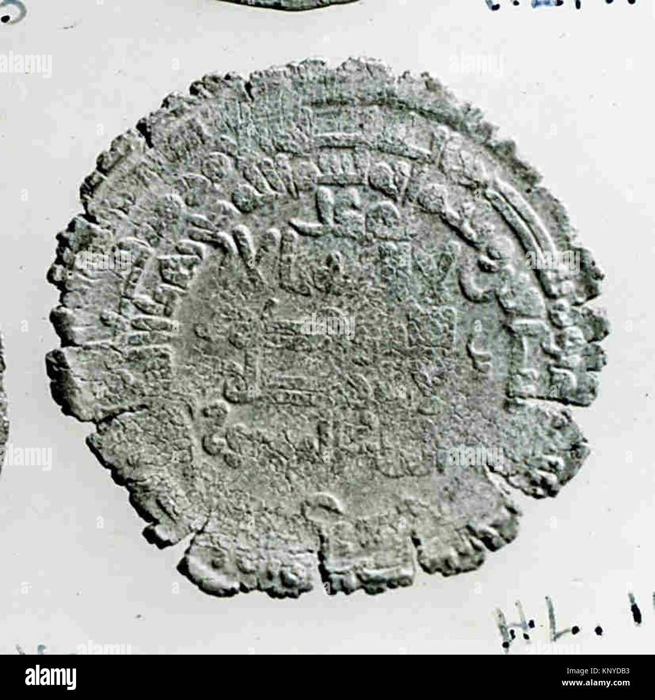 Ancient metal coin with inscriptions on obverse and reverse sides ...
