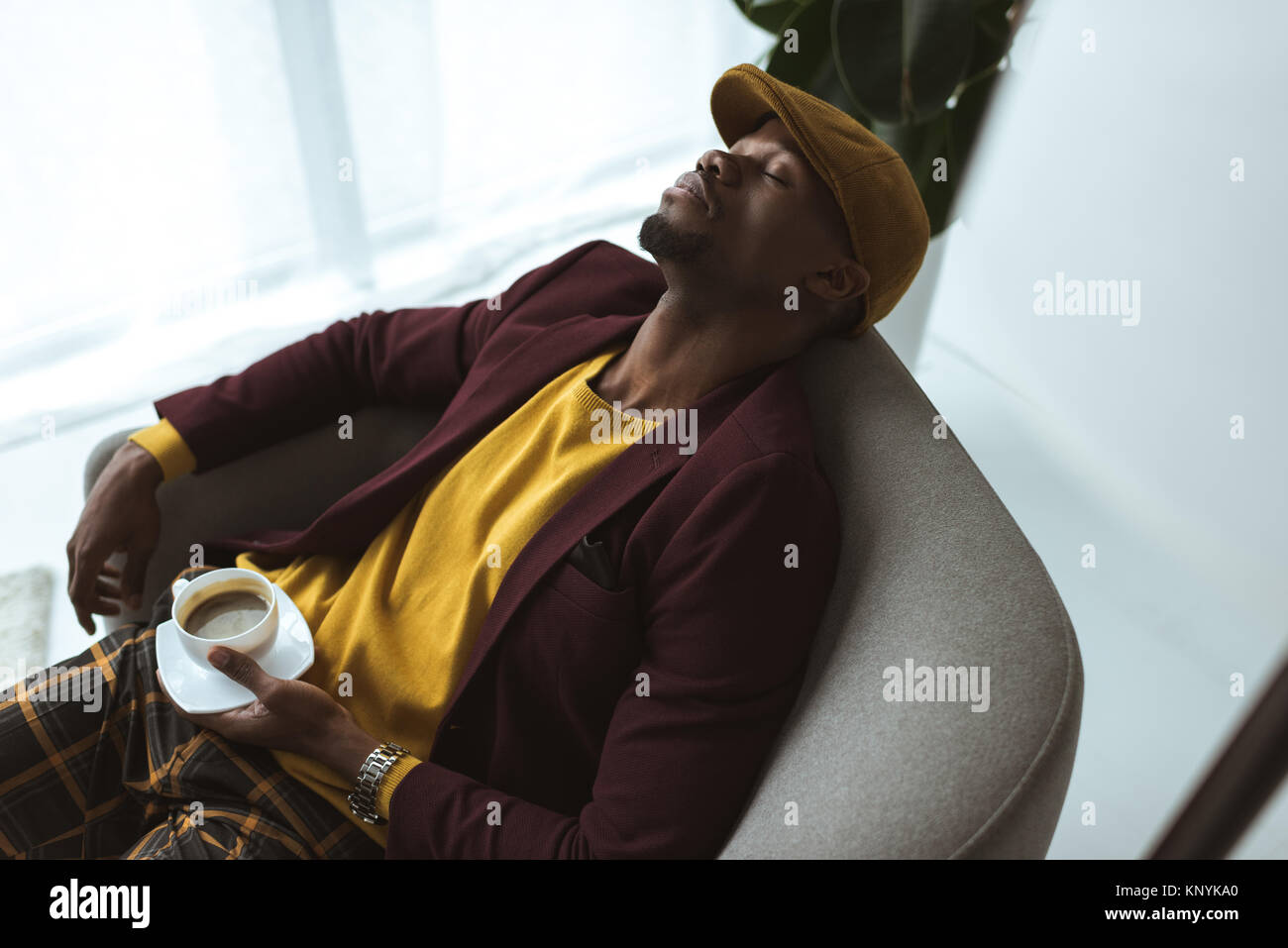 man sleeping in armchair Stock Photo - Alamy