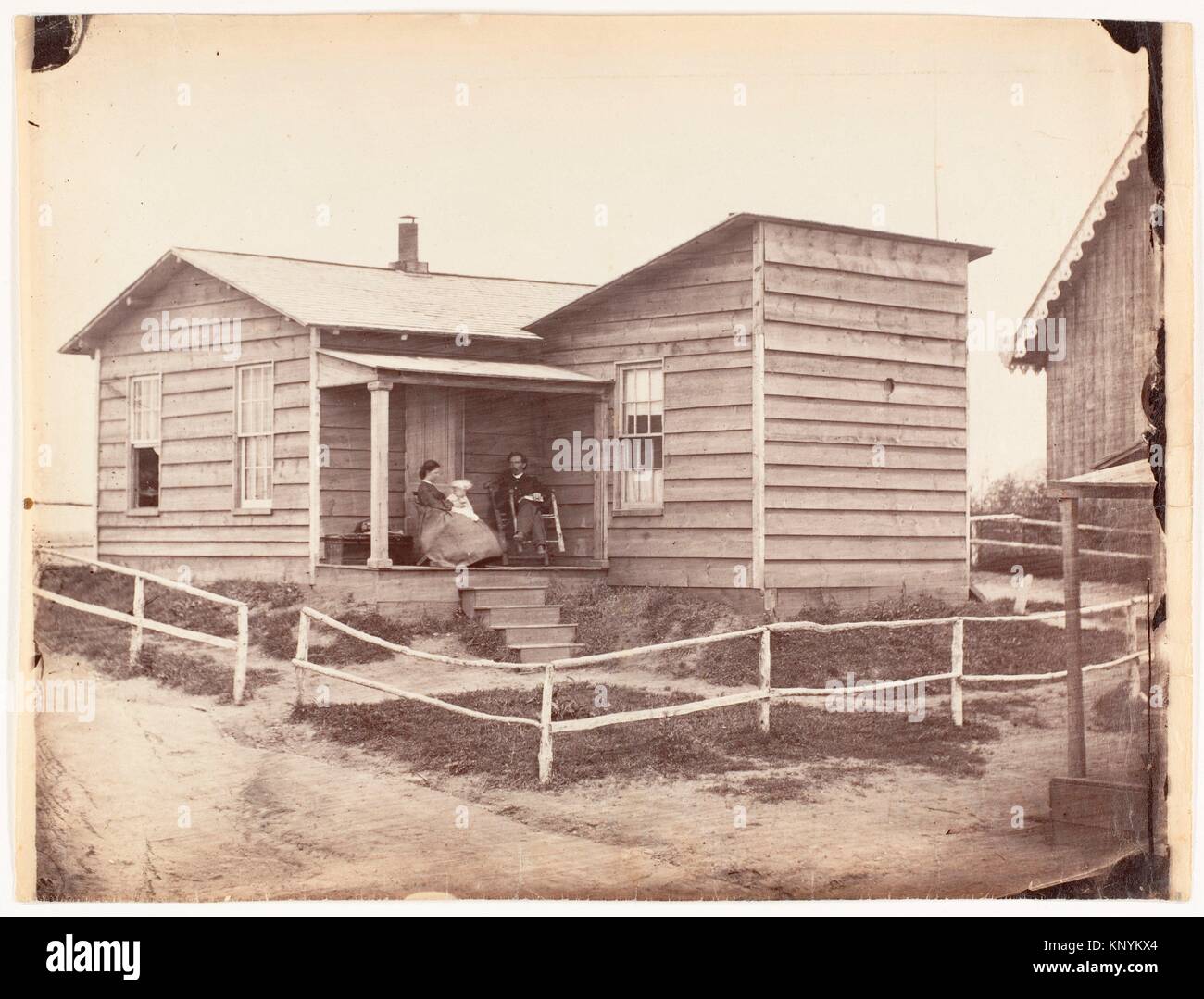 [A Frontier Home]. Artist: Unknown; Date: 1860s-70s; Medium: Albumen silver print from glass negative; Dimensions: Sheet: 7 3/8 x 9 15/16 in. (18.8 x Stock Photo