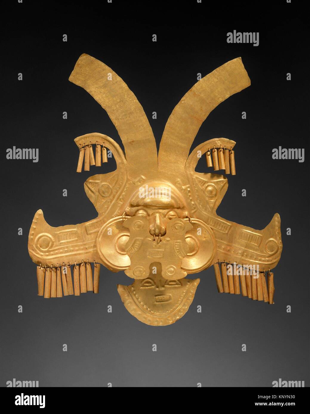 Headdress Ornament. Date: 1st-7th century; Geography: Colombia; Culture: Calima (Yotoco); Medium: Gold; Dimensions: H. 10 x W. 9 3/8 in. (25.4 x 23.8 Stock Photo