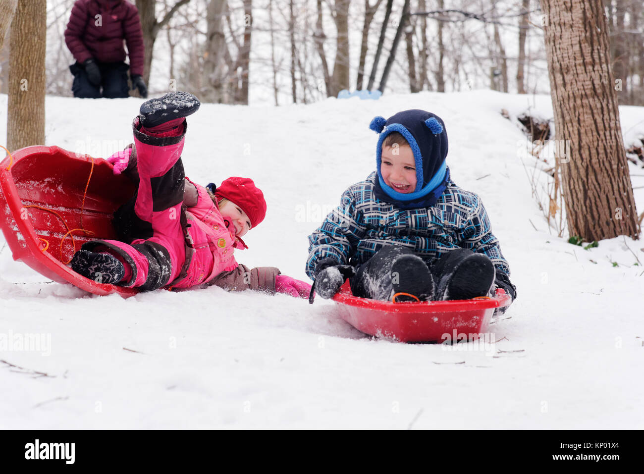 Family playing together in the snow hi-res stock photography and images ...
