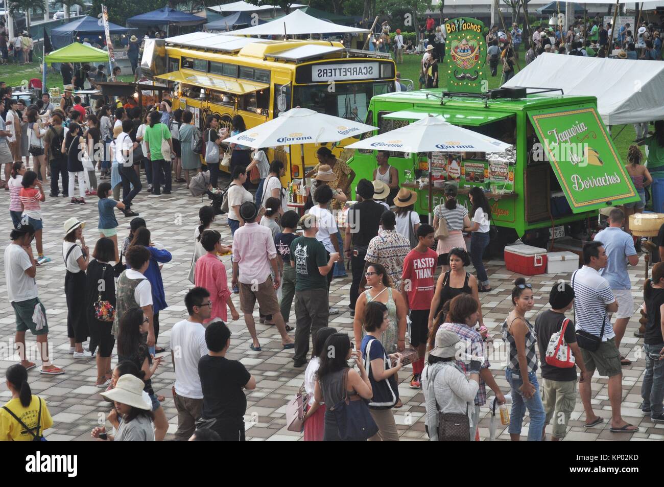 Naha, Okinawa, Japan: people at the Food Flea Market in Tomarin Stock Photo