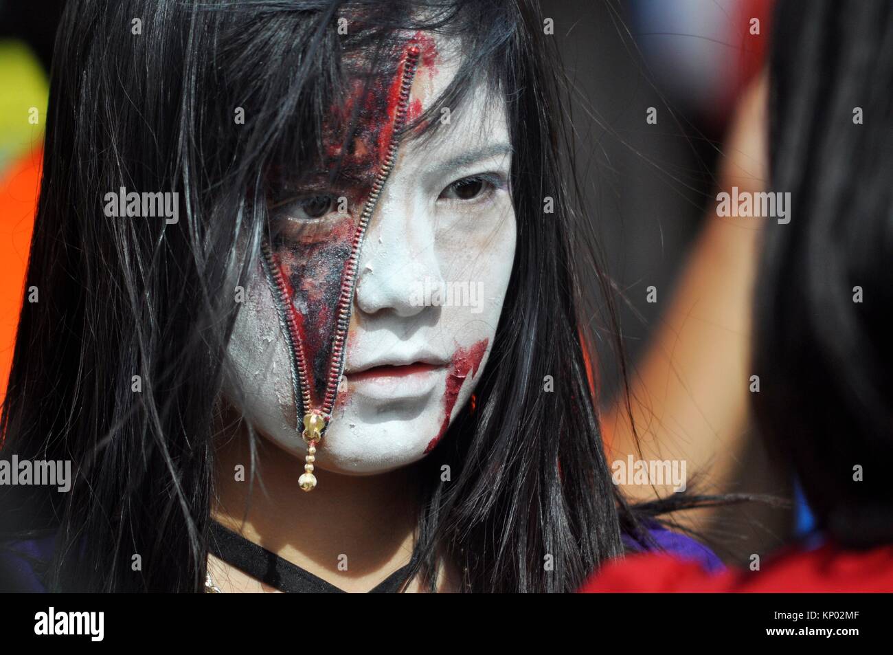 Chatan, Okinawa, Japan: Japanese girl at the American Village of Miyama during Halloween Stock Photo