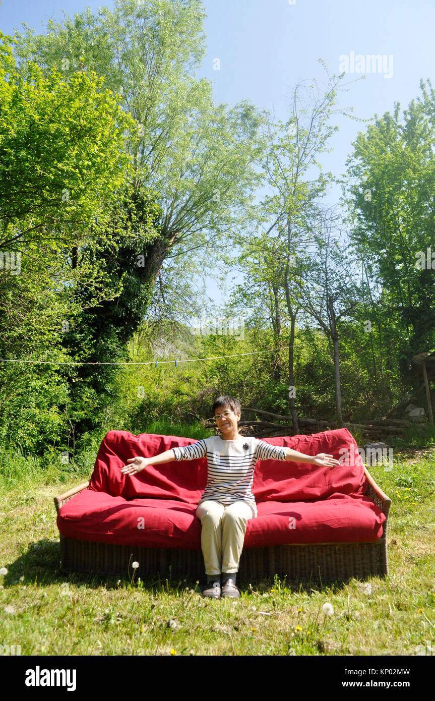 Bologna, Italy: Japanese woman on a couch at Palesio, near Bologna Stock Photo