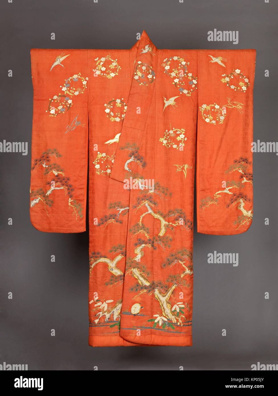 Furisode. Date: 19th century; Culture: Japanese; Medium: Possibly beni-dyed light red (orange) silk, figured satin weave, embroidered and couched in Stock Photo
