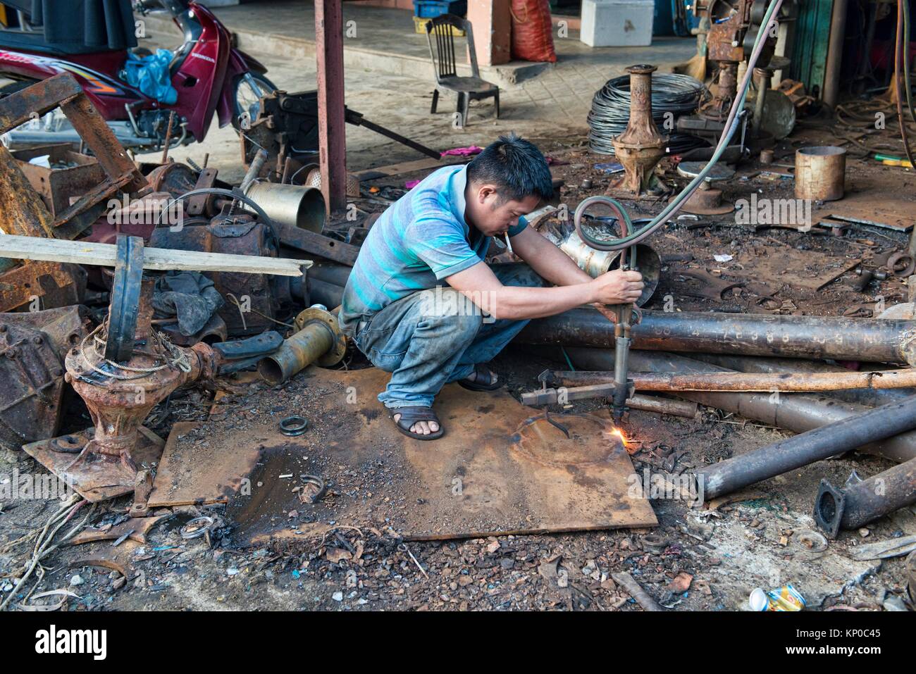 Metal worker, Hoi An, Vietnam. Stock Photo