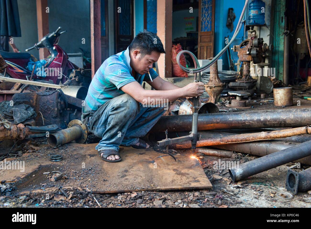 Metal worker, Hoi An, Vietnam. Stock Photo