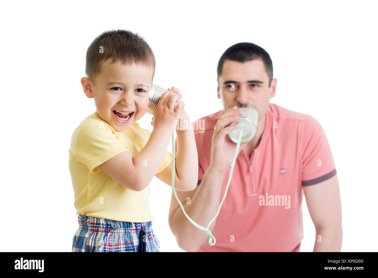 Child boy and dad having a phone call with tin cans Stock Photo