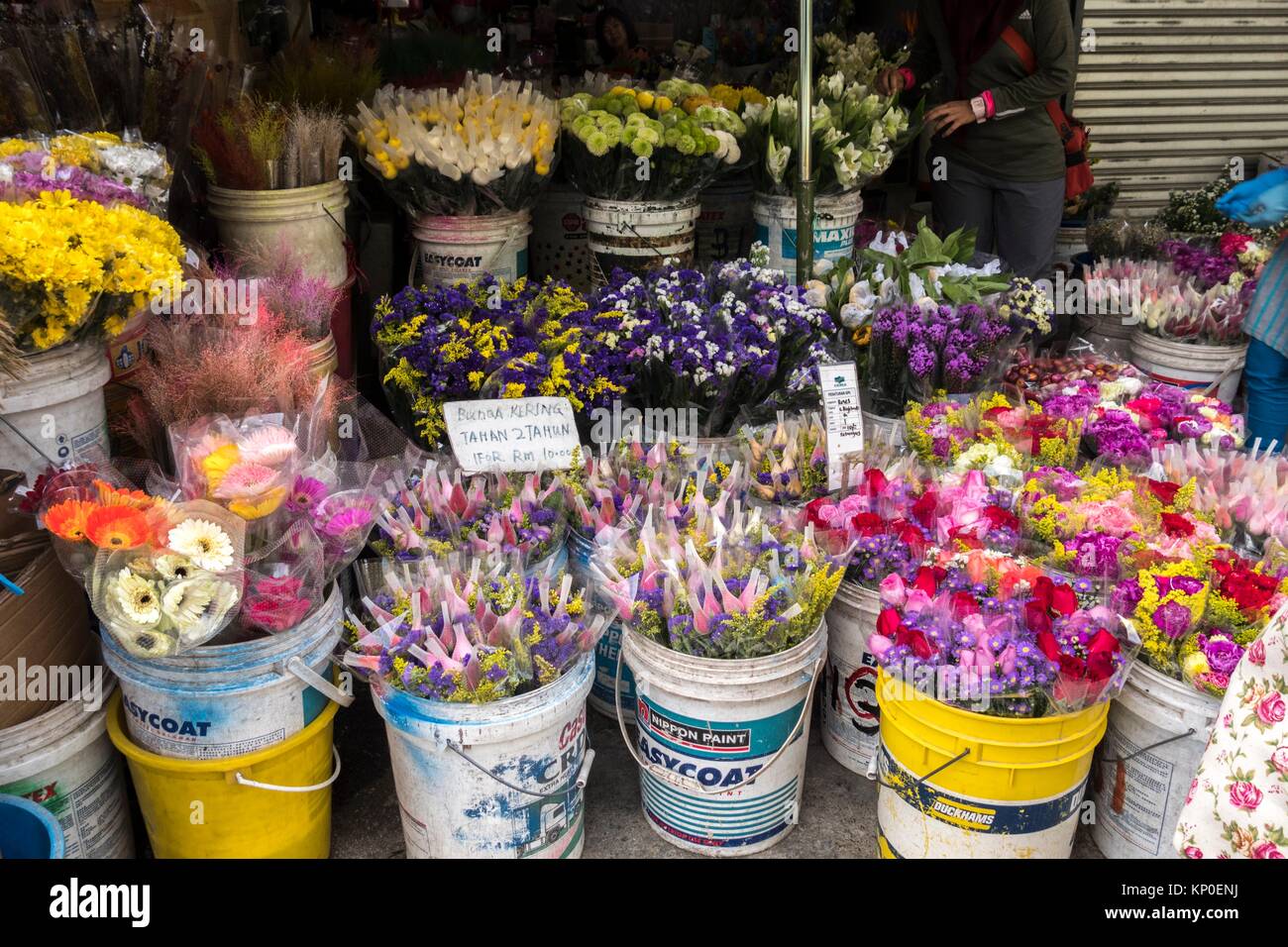 Flower arrangements in buckets, packed for sale at farmers market