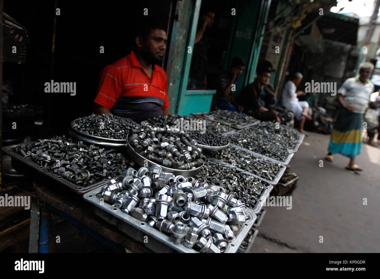 Workers seen outside of a vehicle scrap shop at Dholai Khal in Dhaka