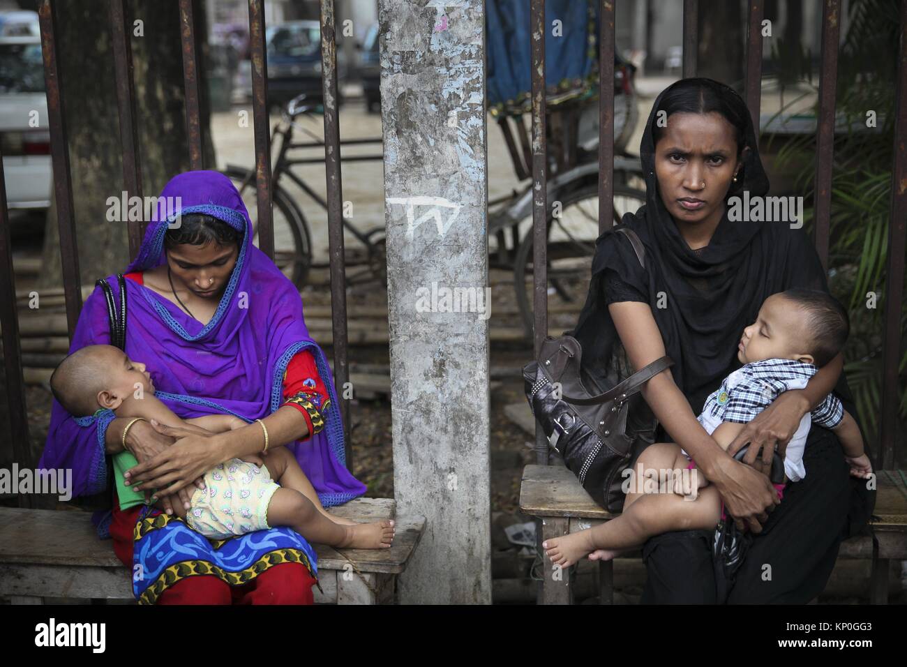 Bangladeshi garments workers attend a demonstration protest for their due salary and wages in front of National Press Club in Dhaka. The  economy of Stock Photo