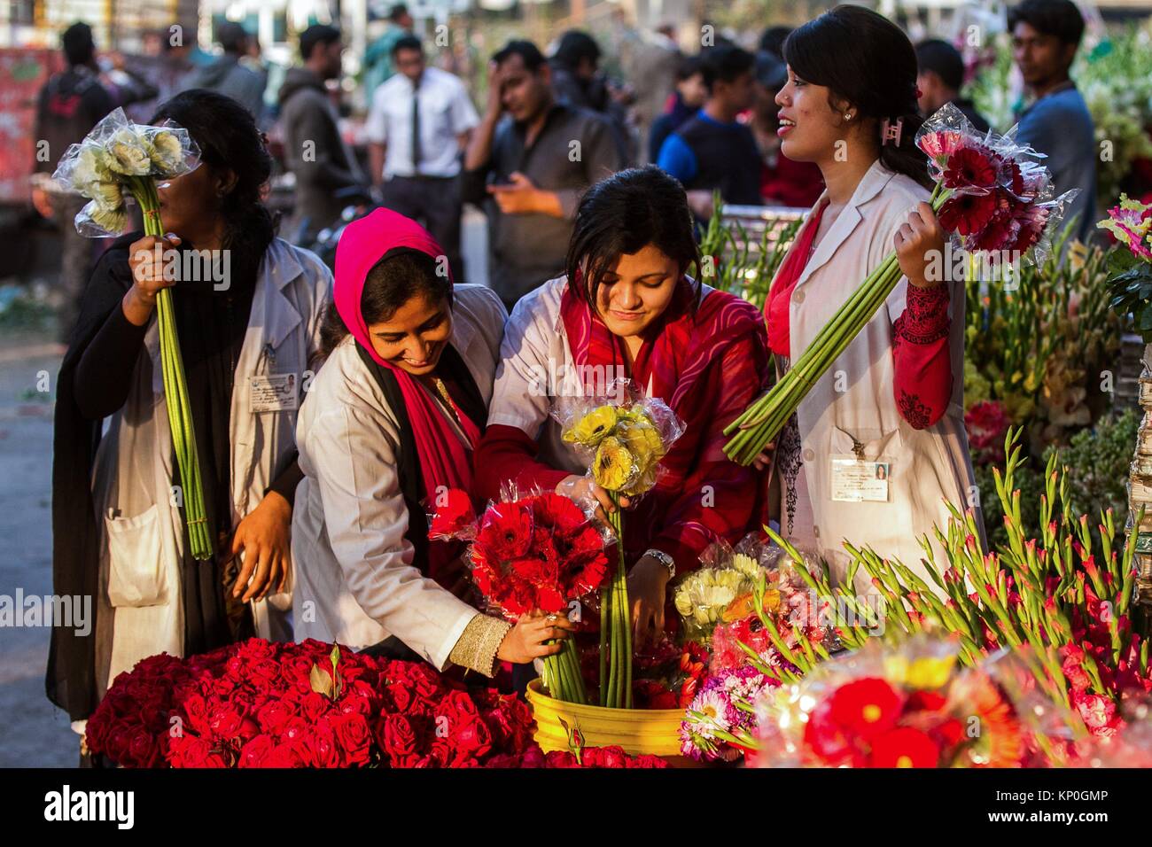 Bangladeshi women busy to buy flowers at Dhaka in Bangladesh. With the wedding season around the corner, our fellow Bengalis are now on the lookout Stock Photo