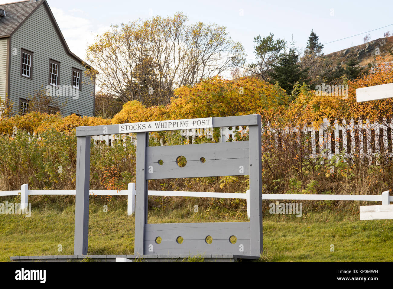 Historic wooden stocks and whipping post in colonial Trinity, Newfoundland, Canada. Stock Photo