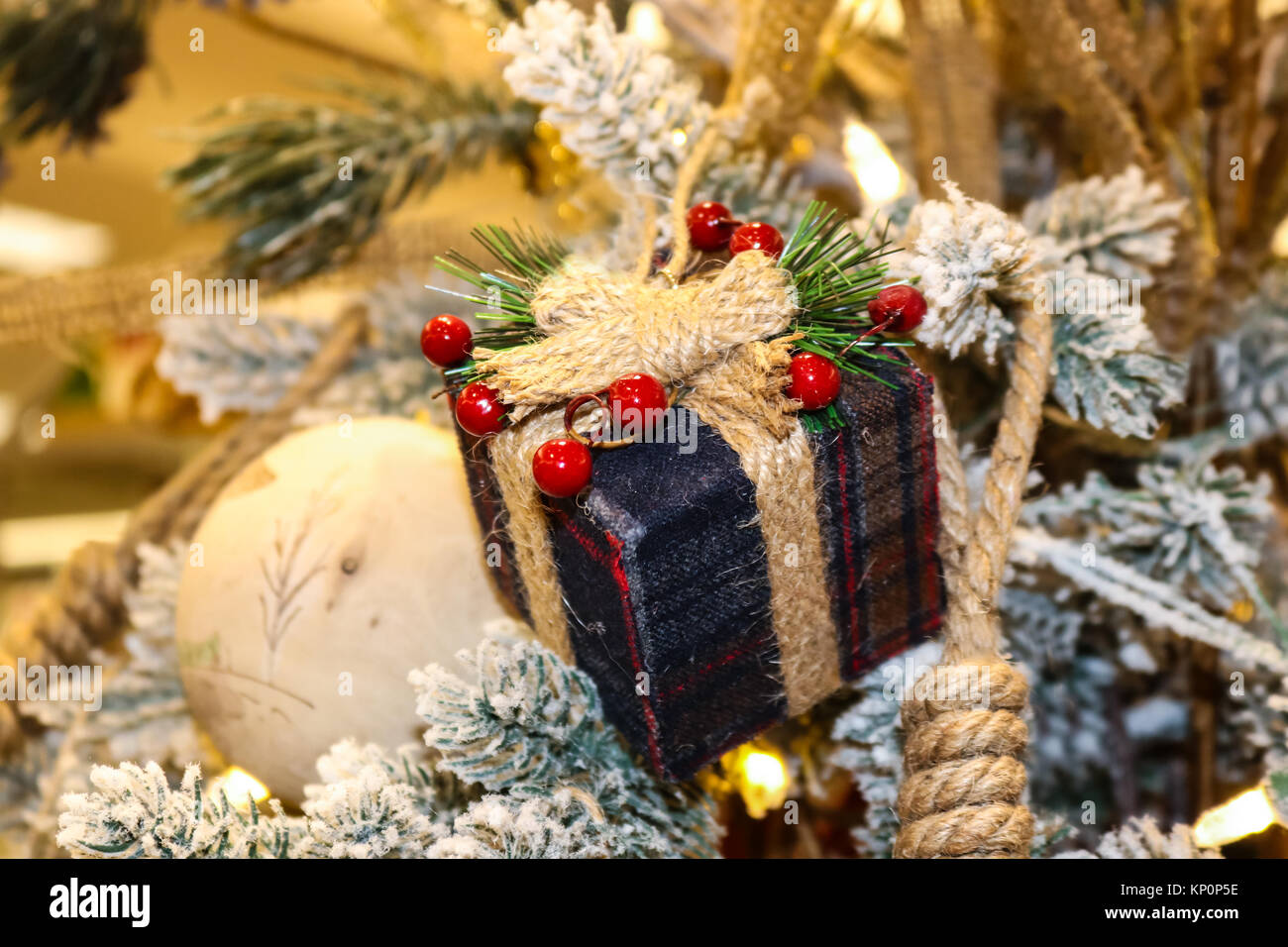 Pile of Christmas wrapped presents with twine string roll, fir tree branch,  Christmas toy star at wooden background. Xmas decoration, cozy festive  Stock Photo - Alamy