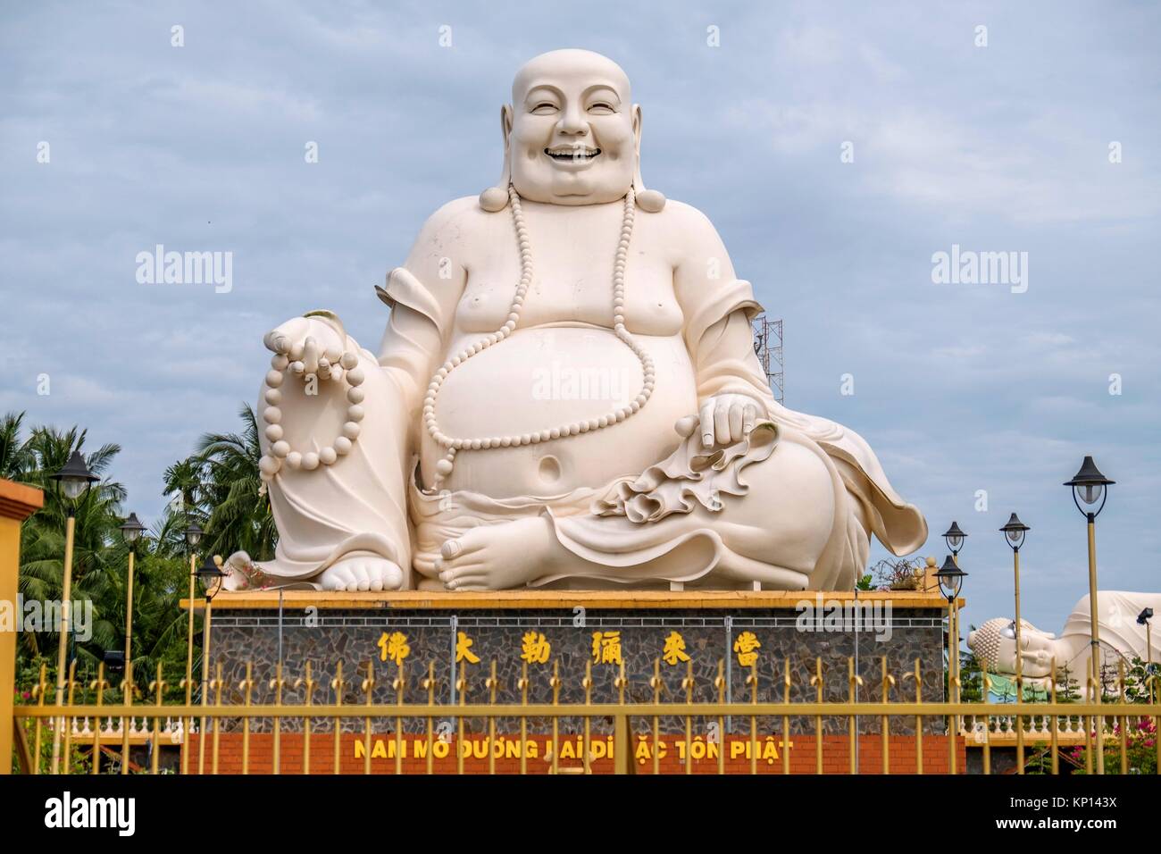 Vietnam, My Tho, Mekong Delta river area. Vinh Trang Pagoda complex, Big Happy Buddha statue (Nam Mo duong Lai Di Lac ton Phat) Stock Photo