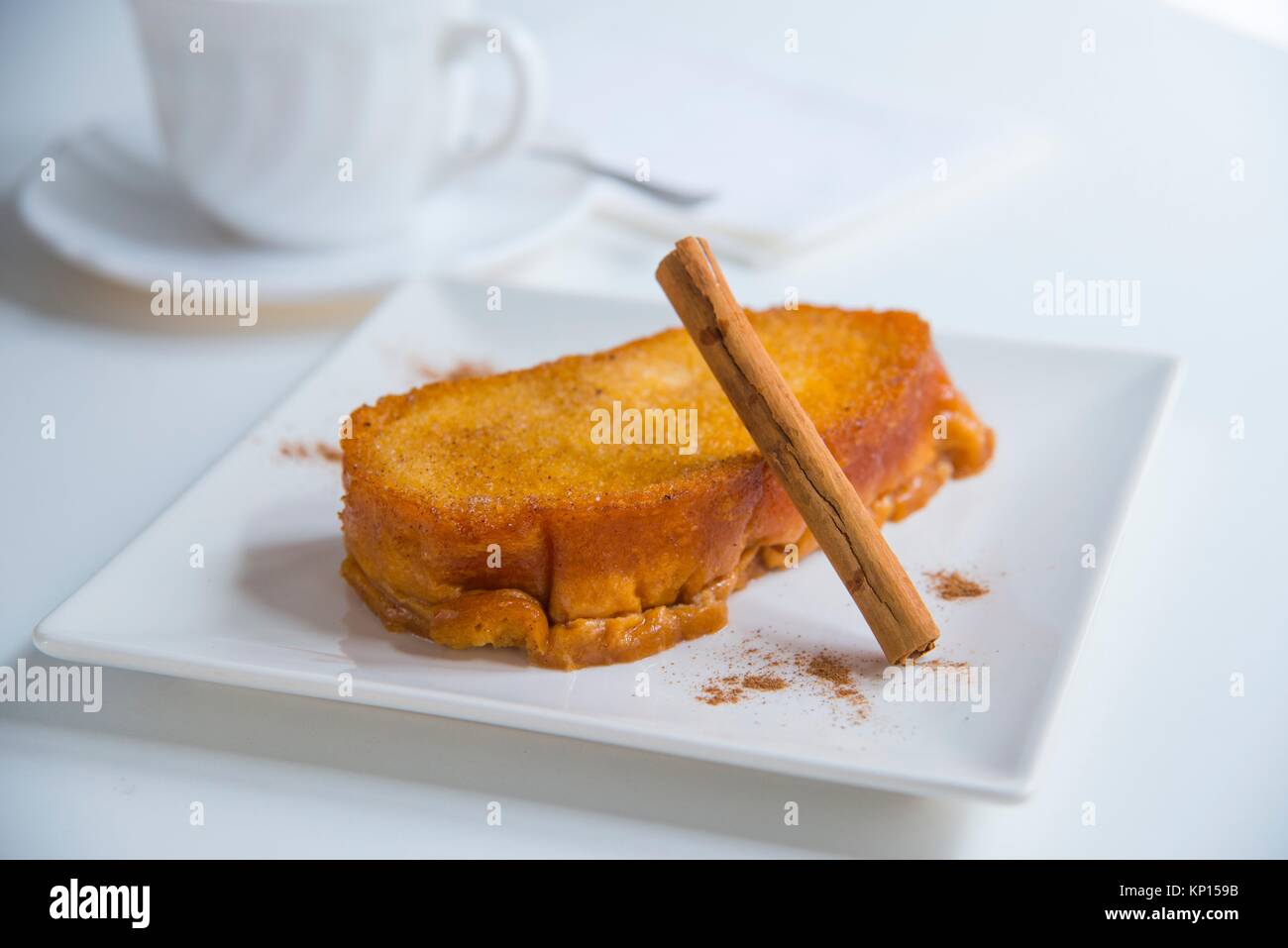 Torrija, typical Spanish Easter dessert, with a cinnamon stick. Spain