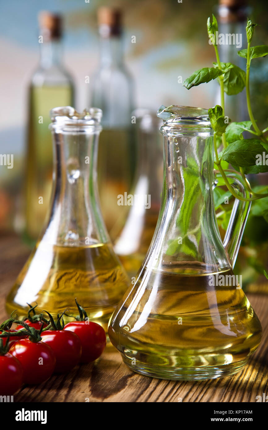 Olive oils in bottles, Mediterranean rural theme Stock Photo Alamy