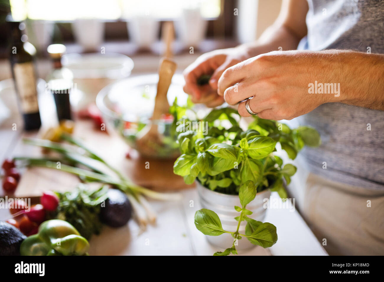 Unrecognizable young man cooking. Stock Photo