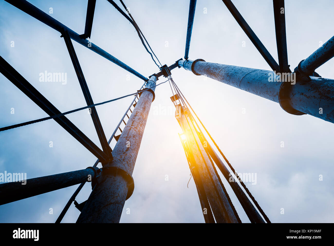 High voltage tower isolated on sky,blue toned. Stock Photo