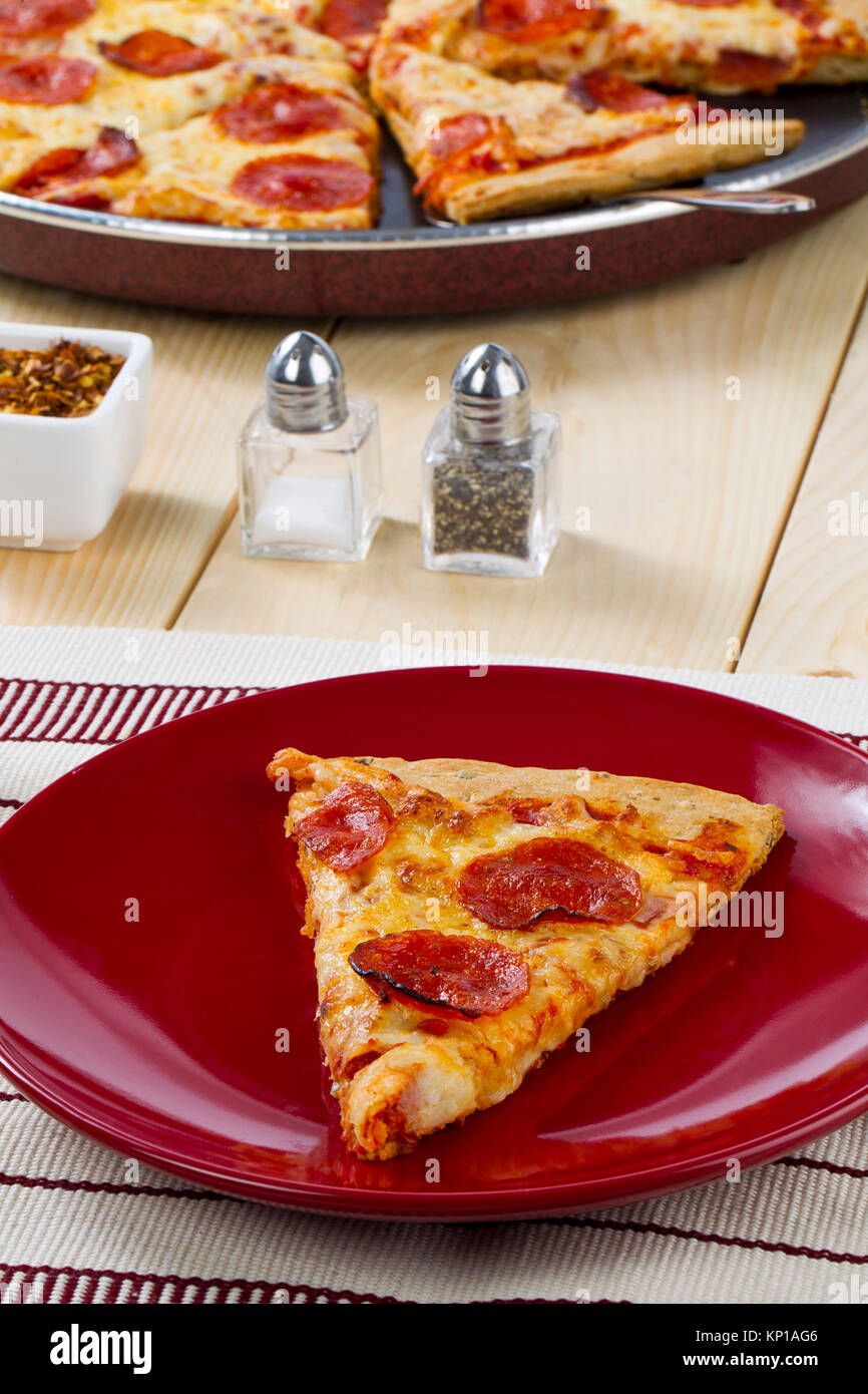 pepperoni pizza with salt and pepper shaker Stock Photo - Alamy