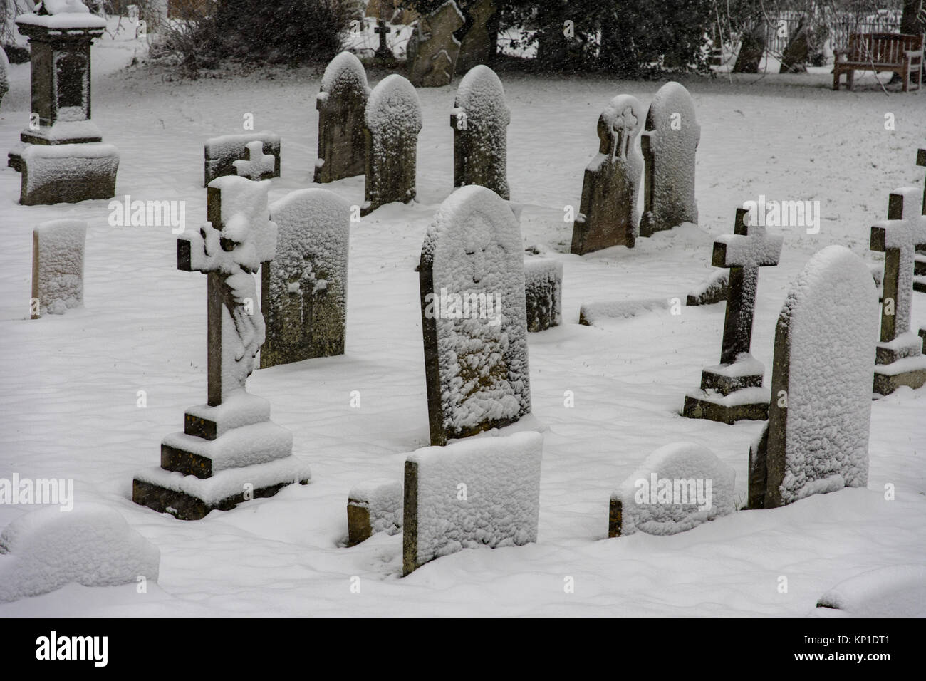 A Cotswold graveyard fin Winter Stock Photo