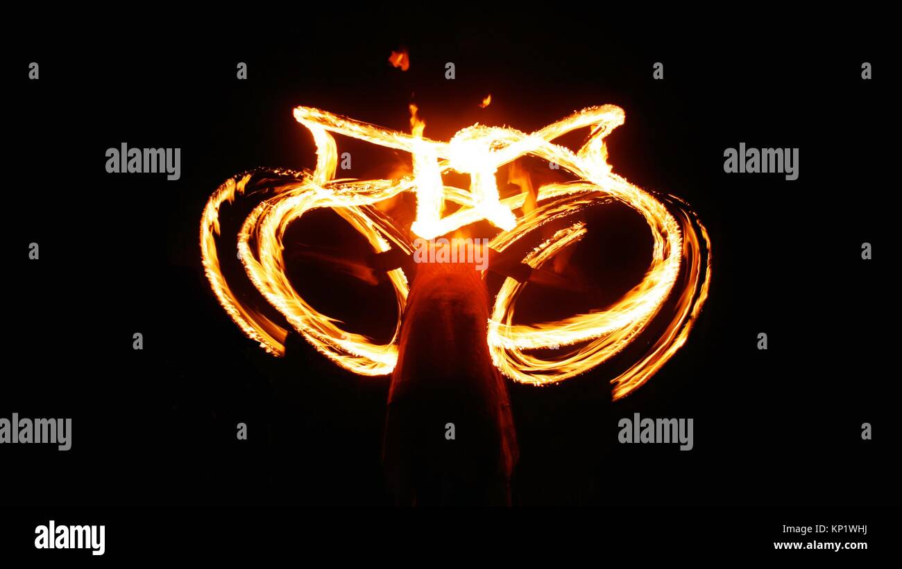 Fire poi show in the dark with blurred performer Stock Photo Alamy