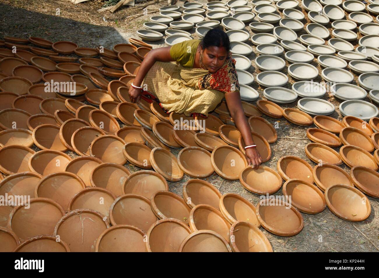 Pottery is the art of earth ware making. The history of Bangladeshi pottery is as ancient as it is illustrious, dating as far back as the Mohenjodaro Stock Photo