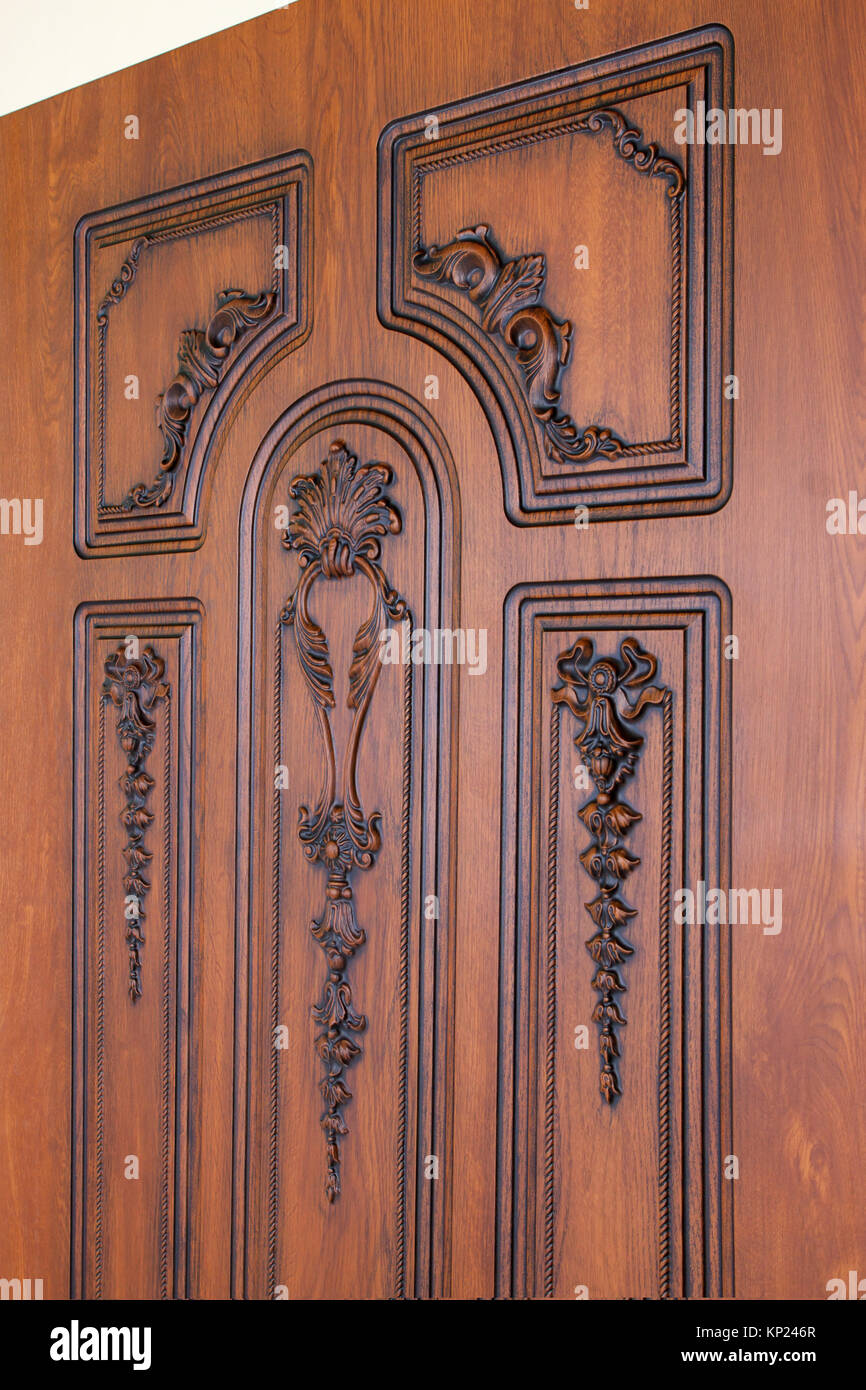 fragment beautiful carved brown wooden door with an emphasis on ...