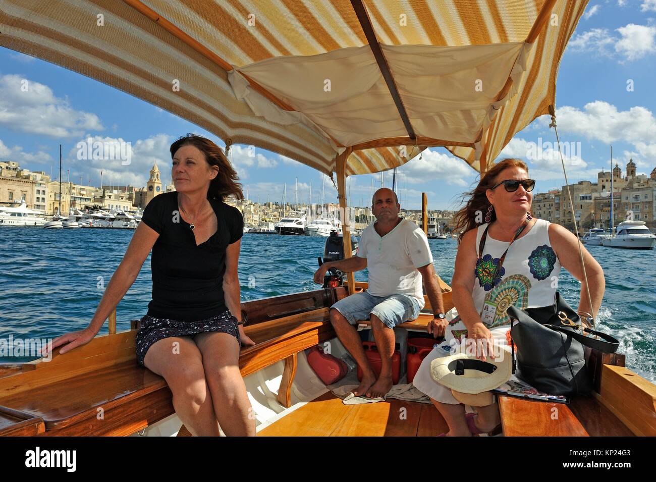 boat trip on a ´´Dghajsa´´ in Grand Harbour from Three Cities to Valletta,  Malta, Southern Europe Stock Photo - Alamy