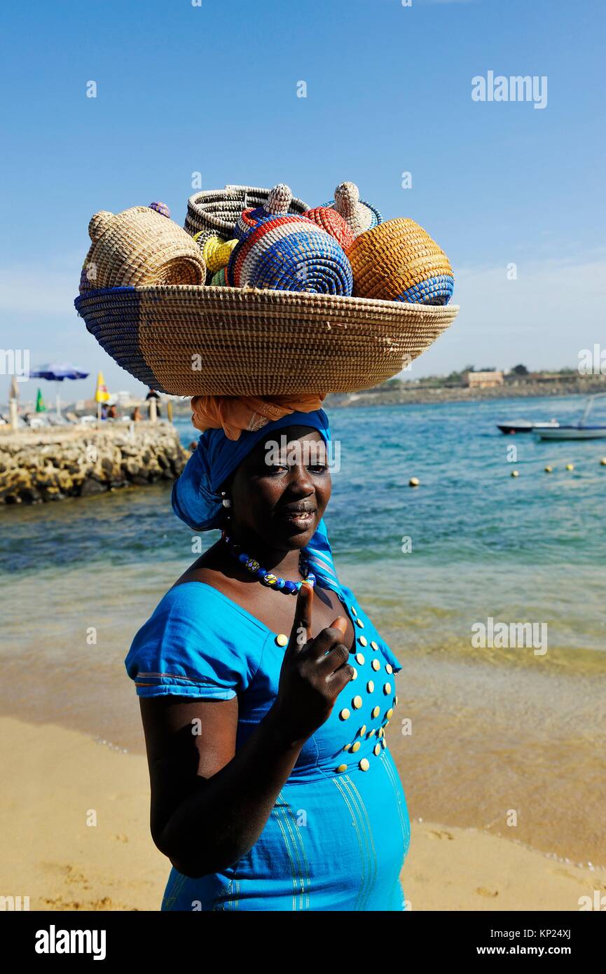woman selling basketry on a beach at Ngor island, Dakar, Senegal, West Africa. Stock Photo