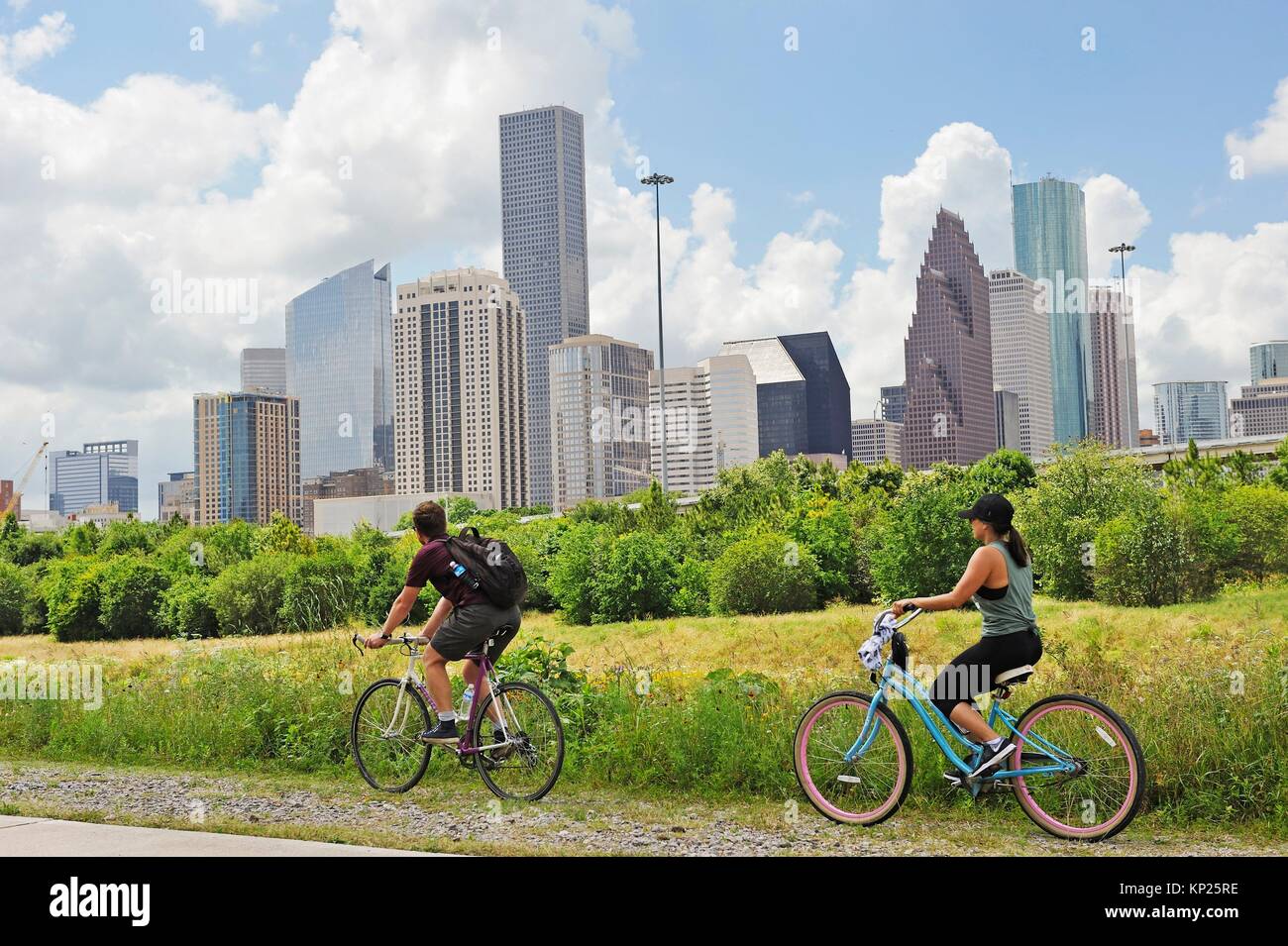 cycle lane along the White Oak River with the skyline in the background, Houston, Texas, United States of America, North America. Stock Photo